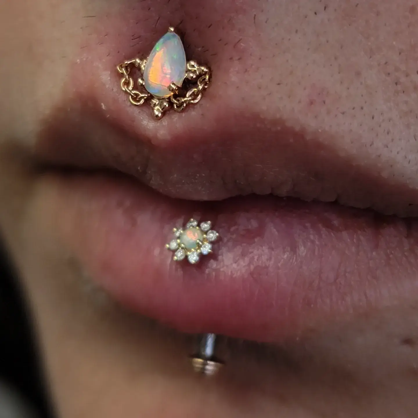 Piercings not done here, jewelry upgraded to a mix of yellow and rose gold with genuine diamonds and opal.